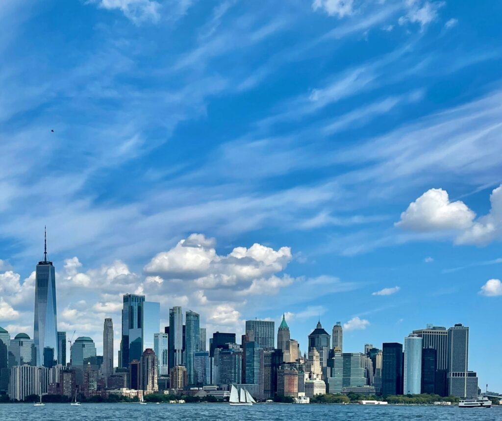 Skyline of New York City at day against a blue sky